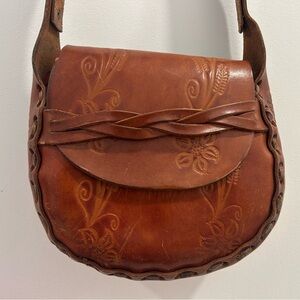 Vintage tooled leather saddle bag